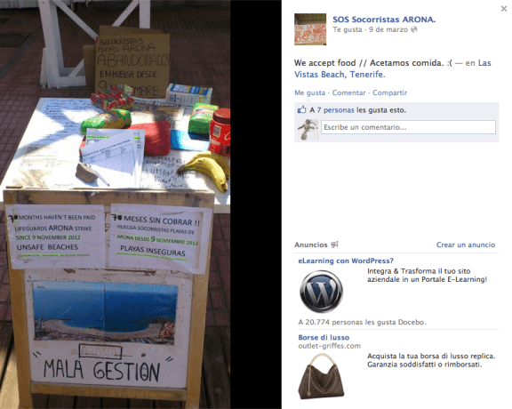 Cartel de "aceptamos comida" en el puesto de salvamento de la playa de Las Vistas.